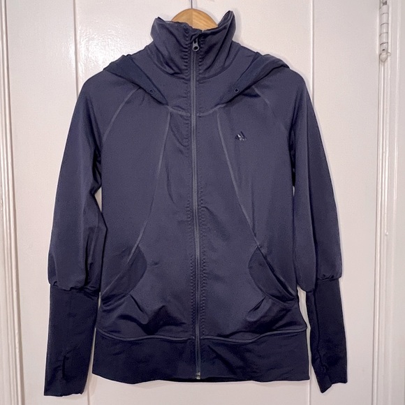 Adidas zip-up with gorgeous feminine details. Thumb holes in the sleeves. Hooded